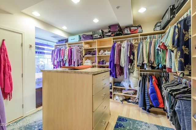 walk in closet featuring light hardwood / wood-style floors