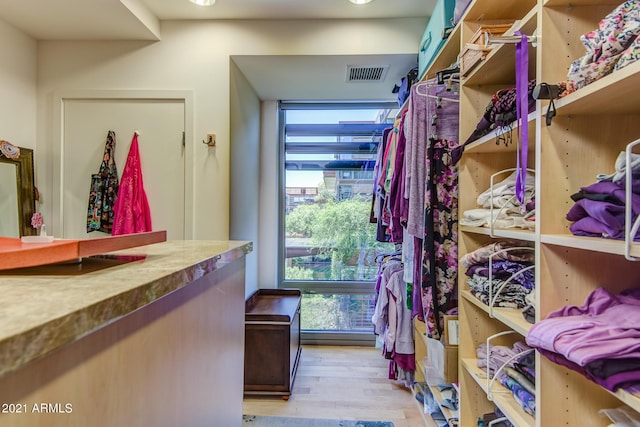 7161 E Rancho Vista Dr Unit 6001, Scottsdale, AZ 85251 - walk in closet featuring light wood-style floors and visible vents