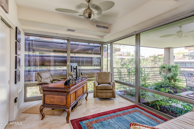 sunroom / solarium featuring ceiling fan and a wealth of natural light