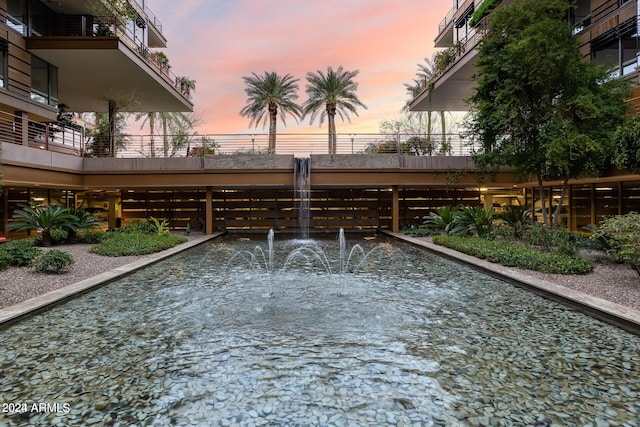 view of pool at dusk