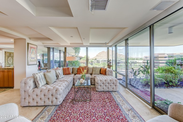 living room featuring a wall of windows