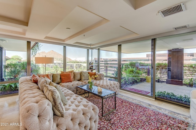 living room featuring a wall of windows