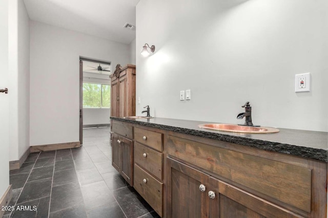 2009 S Raindance Rd, Apache Junction, AZ 85119 - bathroom with double vanity and a ceiling fan
