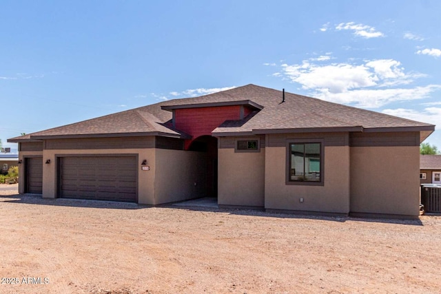 2009 S Raindance Rd, Apache Junction, AZ 85119 - prairie-style house with a shingled roof, a garage, and dirt driveway