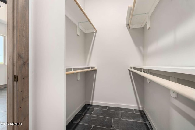 2009 S Raindance Rd, Apache Junction, AZ 85119 - walk in closet featuring dark tile patterned flooring