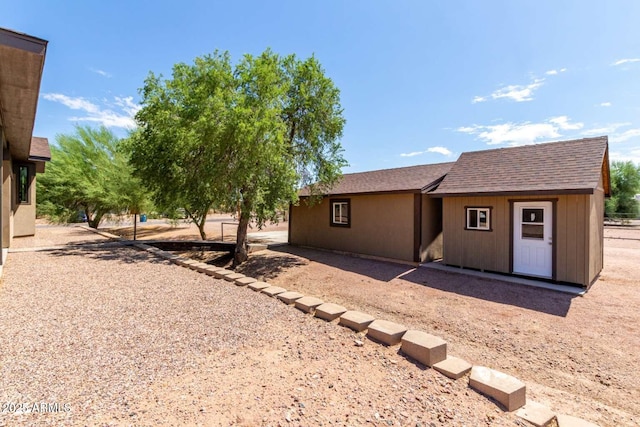 2009 S Raindance Rd, Apache Junction, AZ 85119 - rear view of house featuring a shingled roof