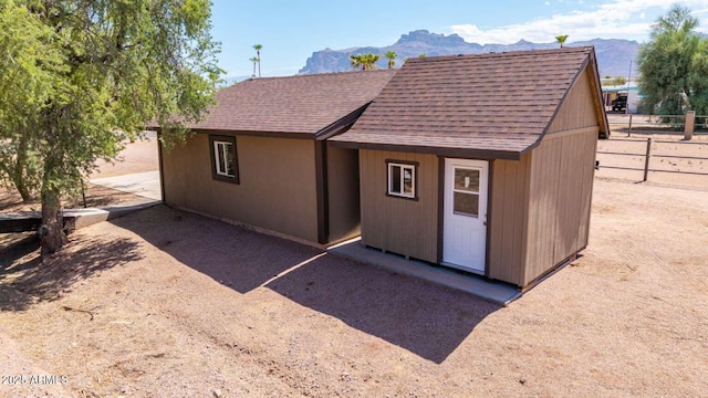 2009 S Raindance Rd, Apache Junction, AZ 85119 - back of house featuring a mountain view and a shingled roof