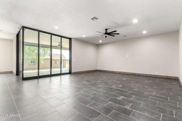 2009 S Raindance Rd, Apache Junction, AZ 85119 - spare room with expansive windows, recessed lighting, and a ceiling fan