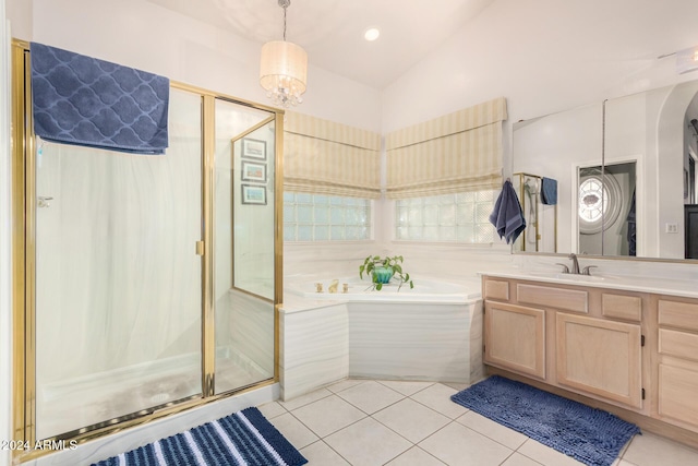 18649 E Mcdowell Mountain Dr, Rio Verde, AZ 85263 - full bathroom with tile patterned flooring, vanity, a shower stall, vaulted ceiling, and a bath
