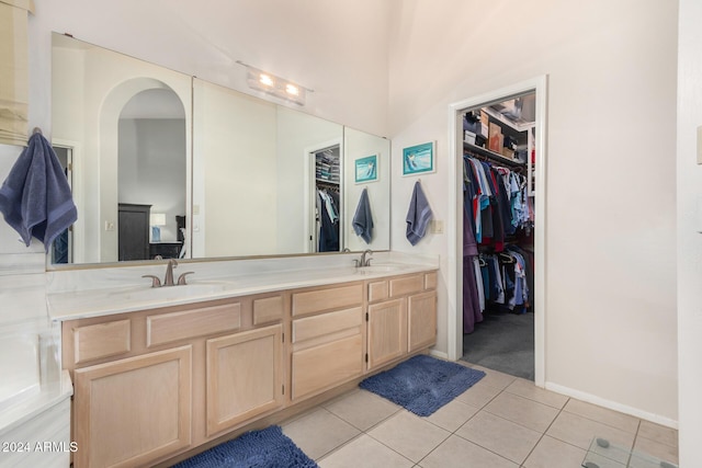 18649 E Mcdowell Mountain Dr, Rio Verde, AZ 85263 - bathroom featuring double vanity, a sink, tile patterned flooring, and a spacious closet