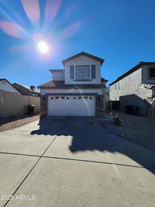 2143 N 30th St, Mesa, AZ 85213 - traditional-style house featuring stone siding, a tile roof, concrete driveway, and an attached garage
