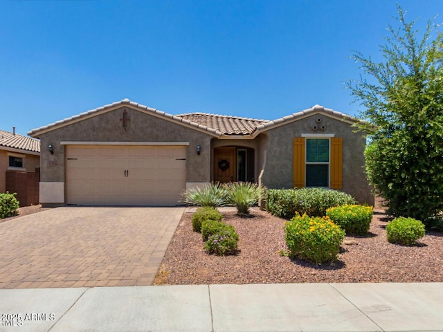 31324 N 26th Gln, Phoenix, AZ 85085 - view of front of home featuring an attached garage, stucco siding, driveway, and a tiled roof