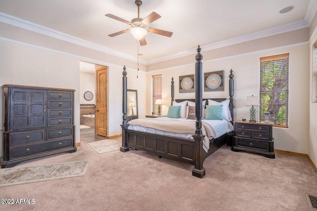 carpeted bedroom with ornamental molding, connected bathroom, and ceiling fan