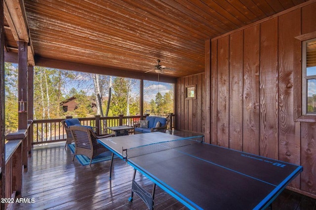 game room featuring wooden ceiling, ceiling fan, and dark wood-type flooring