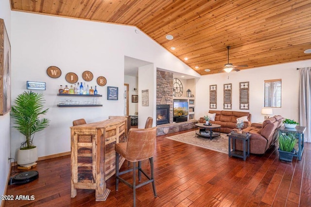 dining area featuring high vaulted ceiling, ceiling fan, dark wood-type flooring, wood ceiling, and a fireplace