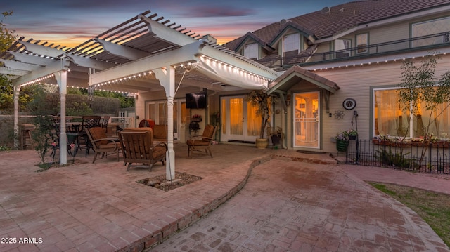 patio terrace at dusk with a pergola