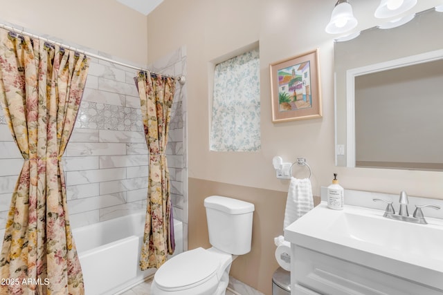 full bathroom featuring vanity, shower / tub combo, and toilet