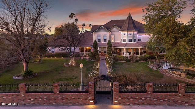 victorian home featuring a lawn