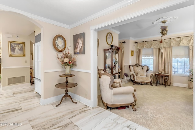 sitting room featuring ornamental molding