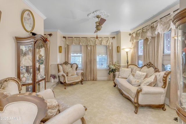 living area with crown molding and carpet