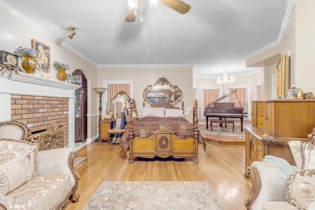 bedroom featuring ornamental molding, a chandelier, and light hardwood / wood-style floors