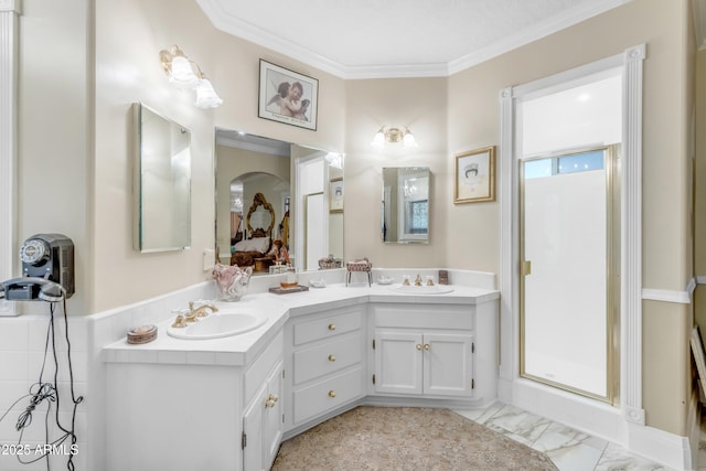 bathroom featuring crown molding, vanity, and a shower with shower door