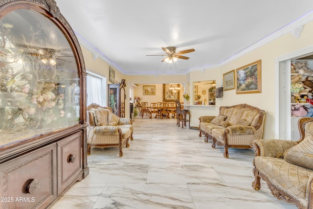 living area with crown molding and ceiling fan