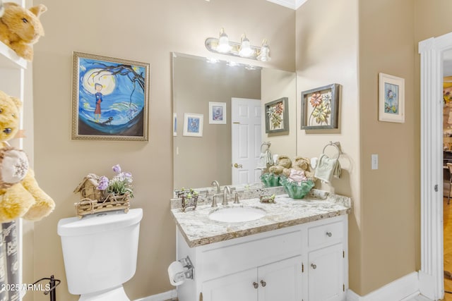 bathroom with vanity and toilet