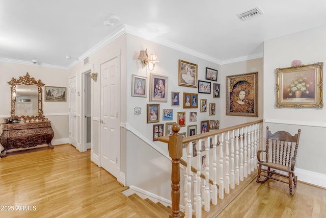 hallway with crown molding and hardwood / wood-style floors