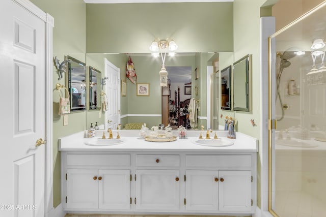 bathroom featuring vanity and a shower with shower door