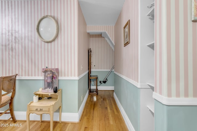 corridor with wood-type flooring