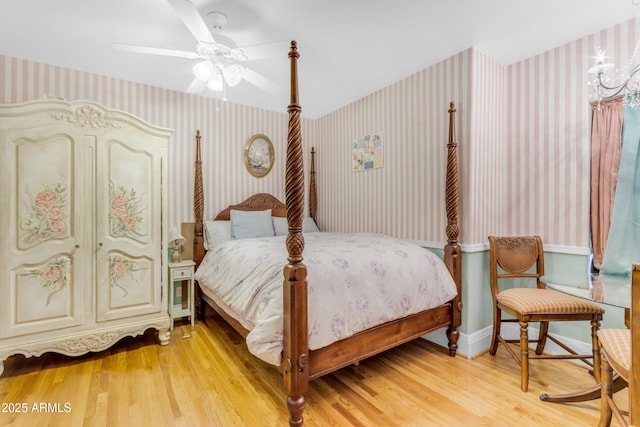 bedroom with ceiling fan and light wood-type flooring