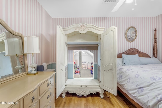 bedroom featuring ceiling fan and light hardwood / wood-style floors