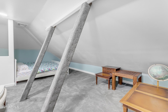 carpeted bedroom with lofted ceiling