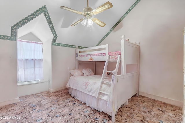 bedroom featuring lofted ceiling and ceiling fan