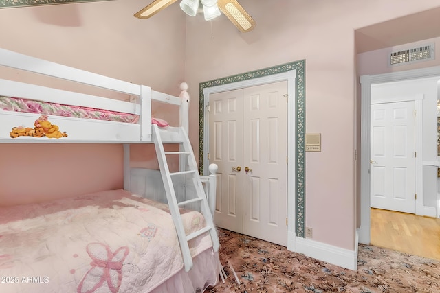 bedroom with ceiling fan and a closet