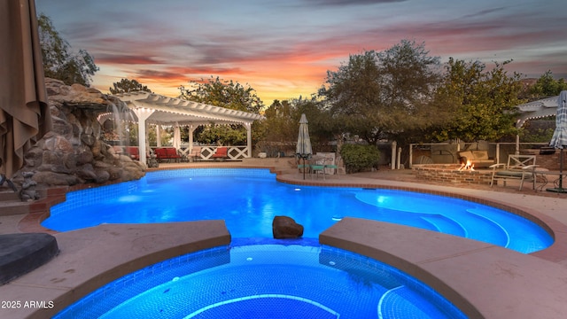 pool at dusk with a pergola, a fire pit, and a patio area