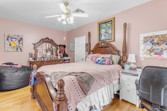 bedroom with ceiling fan and light hardwood / wood-style flooring