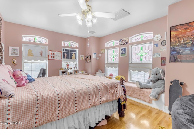 bedroom featuring wood-type flooring and ceiling fan