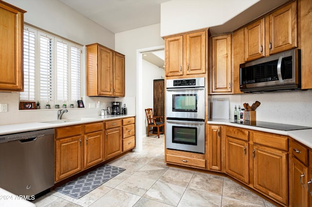 kitchen featuring appliances with stainless steel finishes and sink