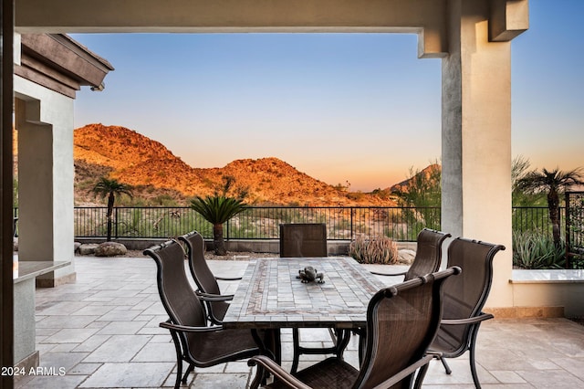 patio terrace at dusk with a mountain view