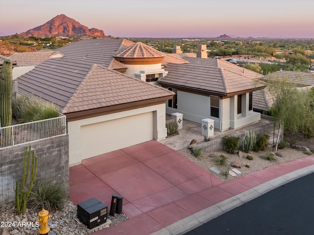 view of front of home featuring a mountain view and a garage