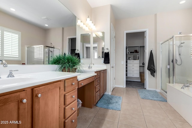 bathroom featuring vanity, plus walk in shower, and tile patterned flooring