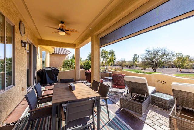 view of patio with ceiling fan, outdoor lounge area, and area for grilling