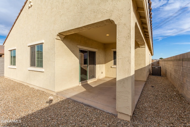 exterior space with cooling unit and a patio