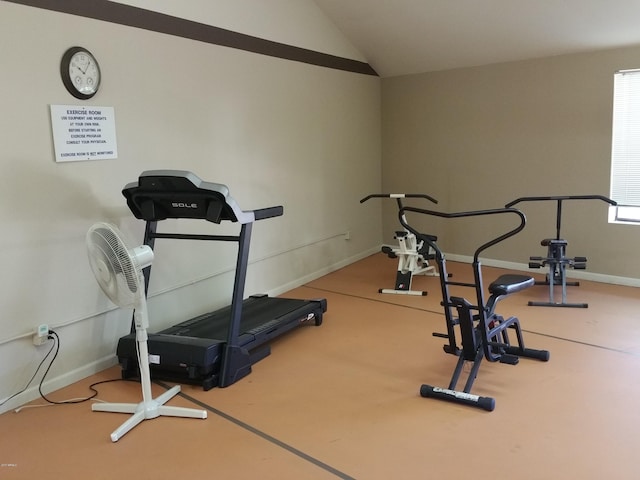 workout room featuring vaulted ceiling