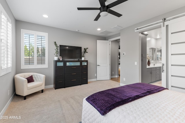 bedroom with a barn door, recessed lighting, light colored carpet, a ceiling fan, and baseboards