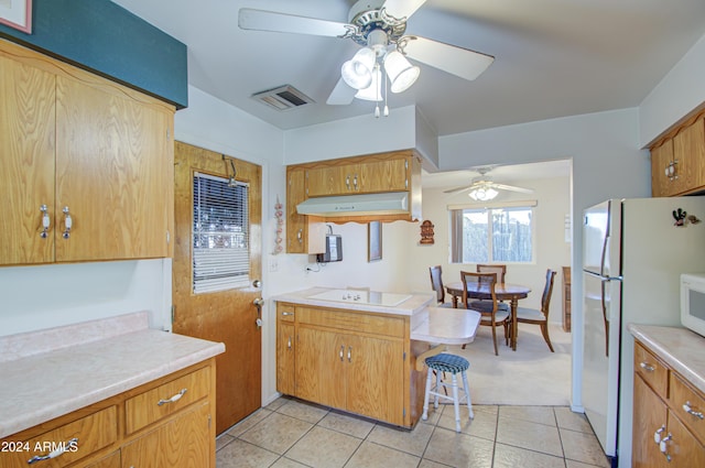 kitchen featuring ceiling fan, light tile patterned floors, extractor fan, and white appliances