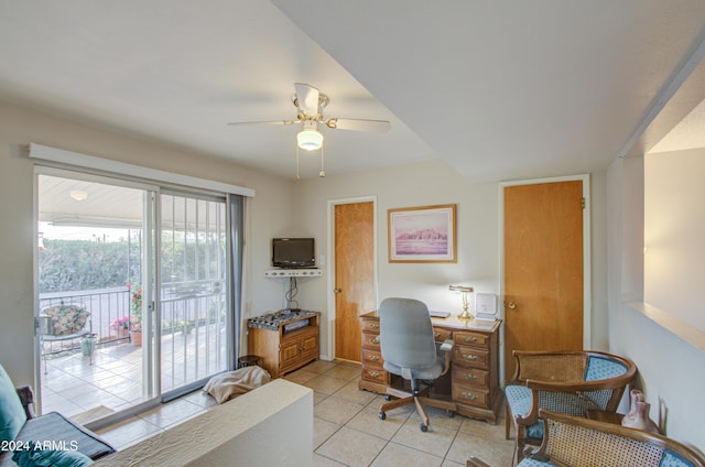 office with light tile patterned floors and ceiling fan