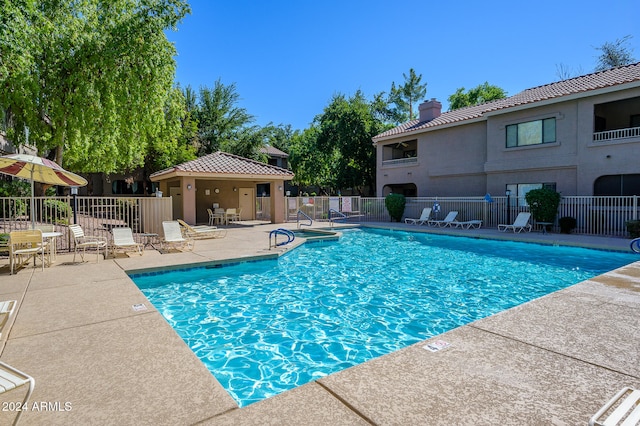 view of swimming pool featuring a patio